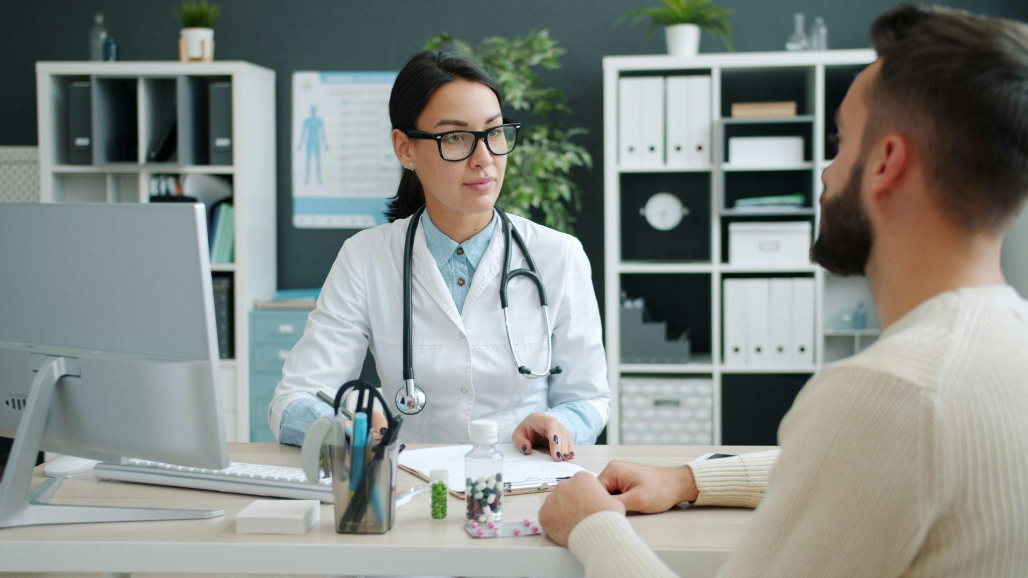 Healthcare professional discussing root canal treatment cover with patient