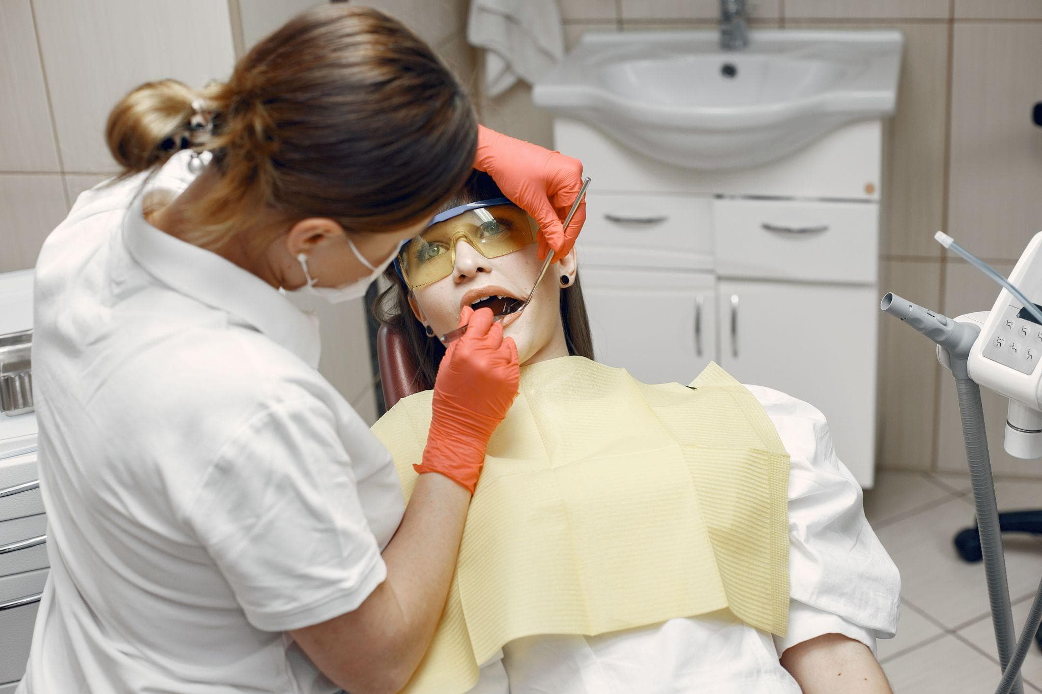 Dentist examining a patient's teeth before root canal treatment